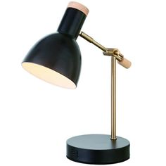 a black and gold desk lamp on a white background