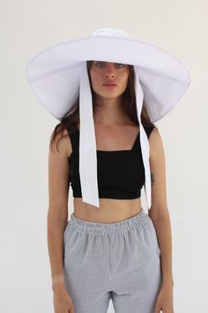 100% Cotton massive oversized floppy sunhat, full shade for face and shoulders, one size fits most, self tie sash for windy weather, or just some extra coverage. Travels and washable. Ultra sun protection. Made from Japanese woven textured cotton. This season the fabric has a textured, last seasons it had no texture. We looooove this hat. So good! Made in California. White Sun Hat For Warm Weather, White Sunbathing Hats With Upf 50+, White Sun Hat With Upf 50+, White Adjustable Sun Hat For Sunbathing, White Sun Bucket Hat With Uv Protection, White Curved Brim Bucket Hat For Vacation, Adjustable White Bucket Hat For Warm Weather, White One Size Sun Hat, White Wide Brim Bucket Hat For Beach