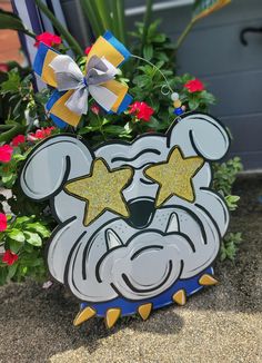 a mickey mouse planter with two stars on it's face and one star in the middle