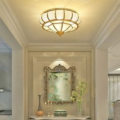 a bathroom with a vanity, mirror and lights on the wall above it's sink