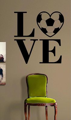 a wall decal with the word love and a volleyball ball