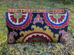 "Small Silk Petit Point Clutch, Handbag Organizer, Make Up Organizer created and handmade in Uzbekistan. Lined with silk and cotton fabric, zipper top.  Each clutch is hand drawn on to cotton canvas, inspired by original designs from Uzbekistan history.  Measures 6\"  high x 10\" width, 9\" opening  Embroidery the same on the front and the back of the clutch Can fit largest sizes of iPhone and Android. 100% silk petit point with handwoven silk and cotton lining. Your purchase preserves and encou Traditional Multicolor Clutch Pouch, Traditional Black Clutch, Traditional Clutch Pouch For Daily Use, Handmade Tapestry Bag For Gift, Traditional Embroidered Tapestry Bags, Traditional Handmade Clutch Pouch, Traditional Handwoven Clutch Bag, Traditional Handmade Clutch With Multicolor Embroidery, Bohemian Handmade Ceremonial Bags