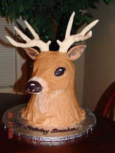 a cake shaped to look like a deer with antlers on it's head