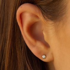 Truly perfect in any piercing location. These studs brighten your face and elevate your ears. Safe for sensitive skin, our pieces are hand crafted and made to wear 24/7. 14k gold filled. Sold as a pair. Available in 2 sizes: tiny 2mm & standard 3mm. Diamond replica AAA cubic zirconia. Dainty 14k Gold Filled Piercings For Everyday, Classic 14k Gold Piercings For Everyday, Classic Everyday 14k Gold Piercings, Dainty Nickel-free 14k Gold Piercings, Everyday Round 14k Gold Piercings, Hypoallergenic Dainty Round Piercings, Minimalist Everyday Round Nose Studs, Dainty Yellow Gold Piercings For Everyday Wear, Classic Round Nose Studs For Gifts