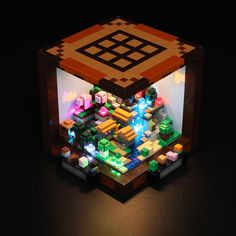 a lit up cube made out of legos with different colored lights on the sides