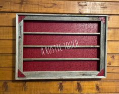 an old window with the words rusted tough written on it in white paint and wood paneling