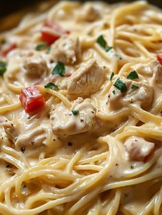 pasta with chicken and tomatoes in a creamy sauce