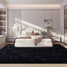 a large white bed sitting in a bedroom on top of a black carpeted floor