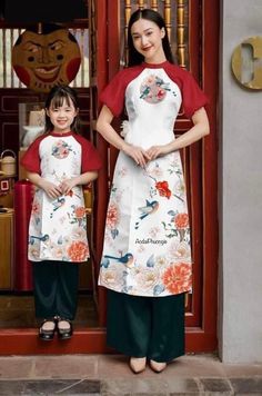 This is a beautiful silk Ao Dai with short red puff sleeves and a short collar. The bird design is imprinted in the Ao Dai soft stretchy silk one-layered fabric.  This style is available for women and girls and can be purchased to match mommy and me. Each Ao Dai set comes with black pants. Both the Ao Dai and pants are zipper enclosures. Very elegant for events like holidays, Tet, and weddings! Please note: These are brand new Ao Dai. There might be occasional sewing chalk residue. It will go aw Traditional Short Sleeve Sets For Spring, Traditional Short Sleeve Spring Sets, Traditional Red Short Sleeve Set, Ao Dai White, 3d Bird, Layered Fabric, York Pa, Bird Print, Bird Design