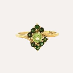 We took inspiration from Cimorene, the princess of Dealing with Dragons to name this beautiful ring made of carefully selected green peridot stones in different tones. A main stone adorned with six small darker toned peridot stones make this piece truly special. Green Peridot is believed to bring good health, restful sleep and peace to relationships. Green Cluster Diamond Ring With Gem, Elegant Multi-stone Peridot Gemstones, Elegant Green Multi-stone Gemstones, Green Emerald Cluster Ring With Center Stone, Green Cluster Diamond Ring Fine Jewelry, Elegant Lime Green May Birthstone Ring, Green Multi-stone Emerald Rings, Green Emerald Cut Multi-stone Diamond Ring, Emerald Cut Green Multi-stone Diamond Ring