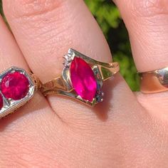 This vintage ring features a vibrant hot pink marquise-cut sapphire, and it's flanked by sparkling diamonds on either side. The mix of yellow and white 10k solid gold gives it a unique, elegant look. Perfect for anyone who loves vintage finds or wants something a little different for an engagement ring. The sapphire is around 12.30mm x 5mm, and the whole piece weighs 2.5 grams. Specifications:  MATERIAL: 10K Solid Gold, Sapphire, Diamond SIZE: 6.75 STONE SIZE: Sapphire approx. 12.30mm x 5mm WEIG Ruby Marquise Cut Birthstone Ring For Anniversary, Ruby Birthstone Ring Marquise Cut For Anniversary, Marquise Cut Ruby Birthstone Ring For Anniversary, Anniversary Ruby Birthstone Ring With Marquise Cut, Heirloom Marquise Birthstone Ring For Anniversary, Ruby Marquise Rings For Anniversary, Heirloom Marquise Ruby Ring With Center Stone, Vintage Marquise Cut Gemstone Rings, Anniversary Ruby Ring Marquise Shape