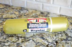 a yellow bottle sitting on top of a granite counter