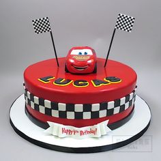 a birthday cake with a car on top