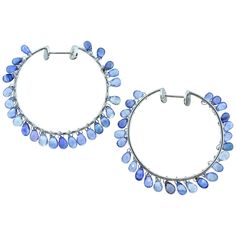 Fine natural light blue sapphire and 18K white gold hoop style earrings by Adler - the fine jewelry house in Geneva. These hand made contemporary medium size hoop earrings are an unusual design with fine stones. 50 briolette cut natural sapphires weighing 10 cts. hang freely creating movement which allows for the light to reflect off the many facets of the fancy cut sapphires. The 10 cts. of fine sapphires are all well cut and well matched - very clean and a fine light to medium pastel blue color. The interior dimensions of these stylish hoops are 1.5 inches. These earrings are in excellent - as new -condition. All items sold are accompanied by a detailed appraisal by our gemologist, as well as all original GIA certificates, if specified in listing. As always, we guarantee all of pieces, f Modern Hoop Earrings, Filigree Hoop Earrings, Light Blue Sapphire, White Gold Hoop Earrings, Gold Diamond Hoop Earrings, Diamond Huggies, White Gold Hoops, Interior Dimensions, Bleu Pastel