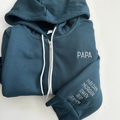 These Bella + Canvas zip up sweatshirts are super soft and cozy! Custom text of your choice will be embroidered on the left chest along with names on the sleeve (8 names max please, if you need more please send me a message to add more on) The text will be embroidered in an all capital font. Custom Text Long Sleeve Sweatshirt For Winter, Customizable Winter Hoodie Tops, Customizable Casual Fleece Hoodie, Winter Custom Embroidery Sweatshirt For Loungewear, Customizable Sporty Winter Sweatshirt, Customizable Blue Hoodie With Long Sleeves, Customizable Hooded Top For Winter, Customizable Hooded Sweatshirt For Fall, Fleece Hoodie Sweatshirt With Letter Embroidery