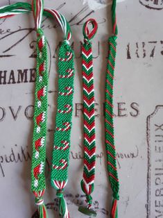 three green, red and white paracorine ties on top of a piece of paper