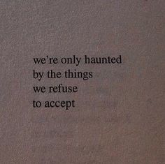 an old book with the words we're only haunted by the things we refuse to accept