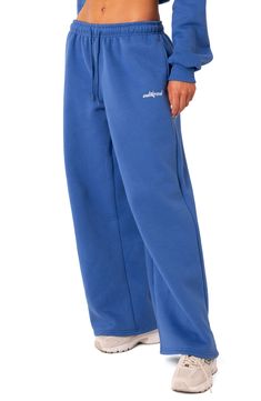 Take your casual style up a notch with these wide-leg sweatpants featuring a low waist and logo detailing. 50% cotton, 50% polyester Machine wash, dry flat Imported Wide Sweatpants, 2025 Wardrobe, Cute Sweats, Cute Sweatpants, Blue Sweatpants, Wardrobe Wishlist, Wide Leg Sweatpants, Vintage Fits, Clothing Pieces