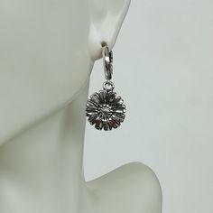 A PAIR of sterling silver hoops. Comes with a cute detachable sunflower charm. The charm is multipurpose and can be used with a neck or bracelet chain too. Dimension: Hoop- 12 mm Charm: 14 x 14 mm Drop length: 29 mm Weight: 6.80 gm Price listed is for a PAIR of hoops. These earrings are made of 925 hypoallergenic sterling silver Can be packaged in a gift box. I can include a personal message from you if needed You are welcome to contact me at... bhavnakwintra1956@gmail.com For more beautiful pie Everyday Flower Charm Hoop Earrings, Sterling Silver Flower Hoop Earrings For Pierced Ears, Silver Dangle Earrings With Flower Charm, Silver Earrings With Flower Charm For Everyday, Everyday Silver Earrings With Flower Charm, Silver Single Flower Earring, Round Hoop Earrings With Flower Charm As Gift, Silver Flower Earrings With Lever Back Ear Wires, Nickel-free Sterling Silver Flower Hoop Earrings