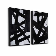 two black and white paintings on a wall