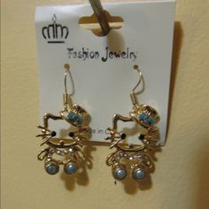 Gold Tone Hello Kitty Earring Teal And White Rhinestones Earrings Are 3" Long Trendy Cat Design Jewelry For Party, Trendy Cat Design Jewelry For Parties, Trendy Jewelry With Cat Ears For Gift, Novelty Blue Drop Earrings, Blue Drop Earrings Cute Jewelry, Blue Drop Earrings Cute Style, Blue Cute Drop Earrings, Accessories Hello Kitty, Hello Kitty Earrings