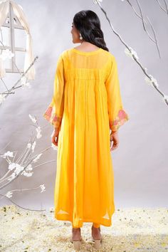 Mango yellow gathered anarkali with floral embroidered sleeves and cross smock details. Comes with leggings and slip. - Aza Fashions Yellow Chikankari Embroidery Salwar Kameez For Spring, Yellow Chikankari Salwar Kameez For Spring, Yellow Kurta With Dupatta For Spring, Floor-length Anarkali Set For Spring, Spring Anarkali Floor-length Kurta, Spring Yellow Anarkali Set With Chikankari Embroidery, Yellow Resham Embroidered Salwar Kameez For Spring, Yellow Anarkali Set With Dupatta For Spring, Bollywood Style Yellow Kurta For Spring