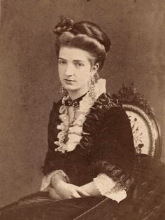 an old black and white photo of a woman