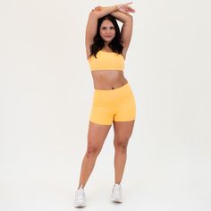 Our Bandeau Sports Bra features straight straps and sleek support for freedom of movement, in style. Heather Marigold is a warm and sunny yellow-orange hue, reminiscent of a vibrant marigold flower in full bloom. This color exudes positivity and energy, making it perfect for those who want a soft burst of color. 1" elastic band A-B cup: medium support, high coverage C-DD cup: low support, medium coverage Straight straps Wide, straight neckline Removable bra cups included Sarah is a 34B wearing s Fashion Pics, Marigold Flower, Dd Cup, Sunny Yellow, Straight Neckline, In Full Bloom, Freedom Of Movement, Muscle Tanks, Bra Cups