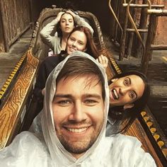 a group of people riding on top of a roller coaster