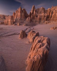 the desert is covered in large rocks and sand