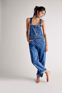 So essential and forever timeless overalls from our We The Free collection. **Fit:** Relaxed, slouchy silhouette **Features:** Bib-and-brace design, tapered legs, exaggerated bib pocket detail, rigid denim fabrication, varied distressing throughout **Why We | We The Free Ziggy Denim Overalls at Free People in Medium Wash, Size: XS Long Jumpsuit Casual, Jumpsuit Casual, Trendy Denim, Retro Mode, Denim Romper, Long Jumpsuits, Denim Overalls, Romper Pants, Clothing Size Chart