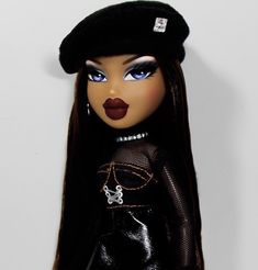 a close up of a doll wearing a black outfit and hat with red lipstick on her lips