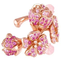 Experience the enchantment of the "Pink Cherry Blossom" jewelry pieces, where the essence of nature is captured in the luminous embrace of 18k pink gold. Each delicate petal, fashioned from the soft hues of pink sapphires, is adorned with brilliant diamond pistils, radiating a timeless allure. The carved pink opal buds, intricately detailed on the ear cuff, add a touch of enchantment, infusing every moment with the delicate fragrance of spring. Indulge in the joy of wearing this exquisite piece, allowing the magic of cherry blossoms to accompany you on your journey. Let their eternal bloom evoke a sense of renewal and celebration, reminding you of the enduring beauty that surrounds us in every season of life. This Cherry Blossom ear cuff offers the beauty of blossoms without the need for p Cherry Blossom Bouquet, Cherry Blossom Jewelry, Blossom Bouquet, Blossom Jewelry, Pink Cherry Blossom, Pink Cherry, Jewelry Tree, Pink Opal, Brilliant Diamond