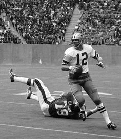 an old photo of a football game being played