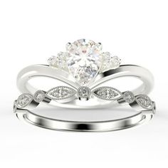 a white gold wedding ring set with an oval cut diamond