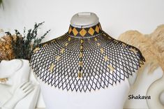 African necklace African jewelry beaded necklace black and gold necklace handmade jewelry mesh necklace cape necklace African accessories PRODUCT SPECIFICATIONS: Necklace length - adjustable, one size fits all. Colors - black and gold. Materials - fine beads ADDITIONAL INFORMATION New and unworn: Yes Handmade in Kenya: Yes Other jewelry in my shop: https://www.etsy.com/shop/shakava Necklace Cape, Black And Gold Necklace, Beaded Necklace Black, African Beads Necklace, African Accessories, Necklace African, Beaded Necklace Patterns, Mesh Necklace, Beaded Necklace Designs