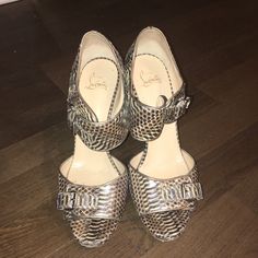 These Are Euc 100% Authentic Christian Louboutin Python Sandals. They Have A Buckle Design And Metal Stiletto Heel. Very Cool And Trendy. Size Eu 40.5 Us 10.5. Comes With Original Box. Luxury Formal Sandals With Wedge Heel, Luxury Party Sandals With Wedge Heel, Designer Formal Wedge Heel Sandals, Luxury Evening Wedge Heels, Designer Wedge Heels With Buckle Closure, Luxury Heels With Buckle Closure For Cocktail, Luxury Wedge Heels With Leather Sole, Luxury Round Toe Heels For Cocktail, Designer Closed Toe Heels With Buckle