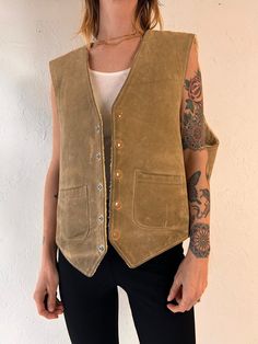 - Vintage JFS suede vest - Faux shearling lining - Very well worn in with lots of signs of age - Snaps up the front - Made in USA - Tagged XL  Chest: 24.5" Length: 24.5" We are not responsible for lost, stolen, or damaged packages once they have been shipped. Any additional customs duties or taxes incurred on international orders are the responsibility of the buyer. Please note that our items are vintage and may have minor flaws or imperfections due to their age, which adds to their unique chara Leather Vest Outfit, Vest Outfits Men, Suede Vest, Mens Vests, Vest Outfits, Leather Vest, Style Expert, Western Outfits, Aging Signs