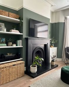 a living room filled with furniture and a flat screen tv on top of a fireplace