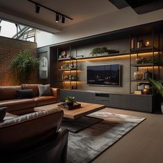 a living room with leather couches and a large tv on the wall in front of it