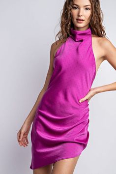 Step out in chic sophistication and style with this Magenta Satin Halter Mock Neck Mini Dress. Crafted from sumptuous satin fabric, this sleeveless mini dress is sure to make a statement with its halter neckline and cut-out back detail. Perfect for any special event, this stunning ensemble is sure to elevate your wardrobe. Fabric & fit: Model is wearing size Small. Glamorous Satin Halter Neck Dress For Summer, Spring Backless Satin Dress For Party, Satin Halter Neck Midi Dress For Summer, Spring Party Backless Satin Dress, Spring Party Satin Backless Dress, Satin Halter Dress For Date Night, Glamorous Satin Halter Dress For Night Out, Glamorous Mini Length Halter Dress, Glamorous Satin Halter Neck Dress