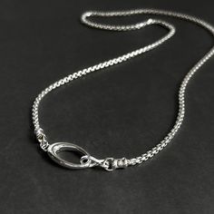 This Solid Sterling Silver Rounded Box Chain Necklace is ideal for creating a classic, timeless look. This weighty, high-quality sterling silver chain is complete with a large oval push clasp, allowing for interchangeable pendants. Details: Chain: Solid Sterling Silver rounded box chain, 2.5mm Clasp: Solid Sterling Silver hinged oval push clasp, 22mm Sizes: 16 inches to 24 inches Shipping: Ready to ship within one business day Complimentary shipping in the USA Complimentary gift wrap Minimalist Oval Silver Chain Jewelry, Minimalist Oval Jewelry With Silver Chain, Classic Silver Chain Necklace With Oval Pendant, Sterling Silver Chain Necklace With Oval Pendant, Classic Chain Necklace With Sterling Silver Oval Link Clasp, Silver Oval Chain Necklace, Oval Sterling Silver Chain Necklace In White Gold, Oval White Gold Sterling Silver Chain Necklace, Silver Oval Box Chain Necklace