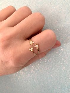 100% handmade 14k solid gold three star diamond ring. The trinity ring is so beautiful and looks stunning worn alone or stacked with your other favorite rings. every item is individually gift wrapped in a cute box with washi tape and a sticker 🎀💝 100% hand made in Los Angeles California with love 💕 🌴 Dainty Rings With Single Cut Diamonds, Yellow Gold Star-shaped Promise Jewelry, Dainty 14k Gold Crystal Ring With Diamond Accents, Minimalist Star Shaped Diamond Jewelry, Minimalist Star-shaped Diamond Jewelry, 14k Gold Star-shaped Fine Jewelry, 14k Gold Star-shaped Diamond Ring With Single Cut Diamonds, Diamond Star Ring For Gift, Star-shaped Diamond Jewelry For Promise