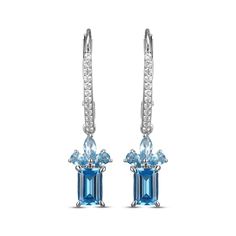 Give her a reason to dress up with these dazzling drop earrings. Crafted in sterling silver Each earring dangle features an emerald-cut Swiss blue topaz Above, a pair of pear-shaped and a marquise-cut London blue topaz create a flourish Round-cut white lab-created sapphires line the linear ear wires The earrings secure with lever backs Blue Topaz Dangle Earrings Fine Jewelry, Sapphire Drop Earrings, Earring Dangle, White Lab, Swiss Blue Topaz, London Blue Topaz, London Blue, Marquise Cut, Earrings Sterling Silver