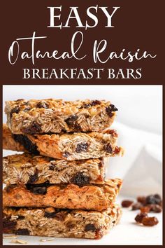 three granola bars stacked on top of each other with raisins around them