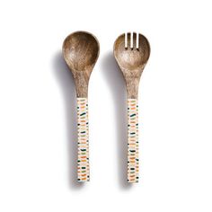 two wooden spoons with designs on them and one has a fork in the middle