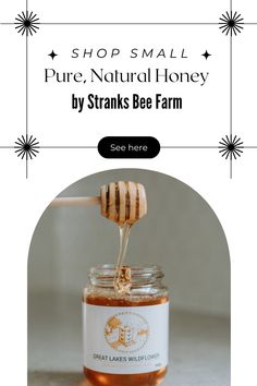 a jar filled with honey sitting on top of a table