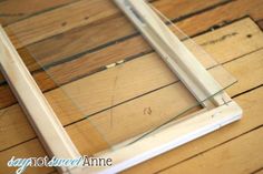 a wooden floor with some glass on it