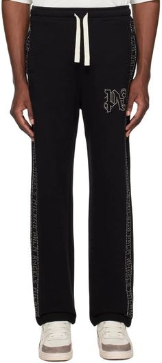 Palm Angels.Black Studded Sweatpants.French terry sweatpants..· Drawstring at elasticized waistband.· Three-pocket styling.· Studded logo detailing at front and outseams.Supplier color: Black gunmetal.100% cotton..Made in Italy..241695M190004 Black Joggers With Logo Waistband For Streetwear, Logo Waistband Athleisure Sweatpants, Athleisure Sweatpants With Logo Waistband, Relaxed Fit Bottoms With Logo Waistband For Streetwear, Streetwear Cotton Pants With Logo Detail, Cotton Streetwear Pants With Logo Detail, Streetwear Athleisure Pants With Logo Detail, Athleisure Streetwear Pants With Logo Detail, Athleisure Pants With Logo For Streetwear