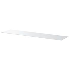 a white shelf sitting on top of a wall